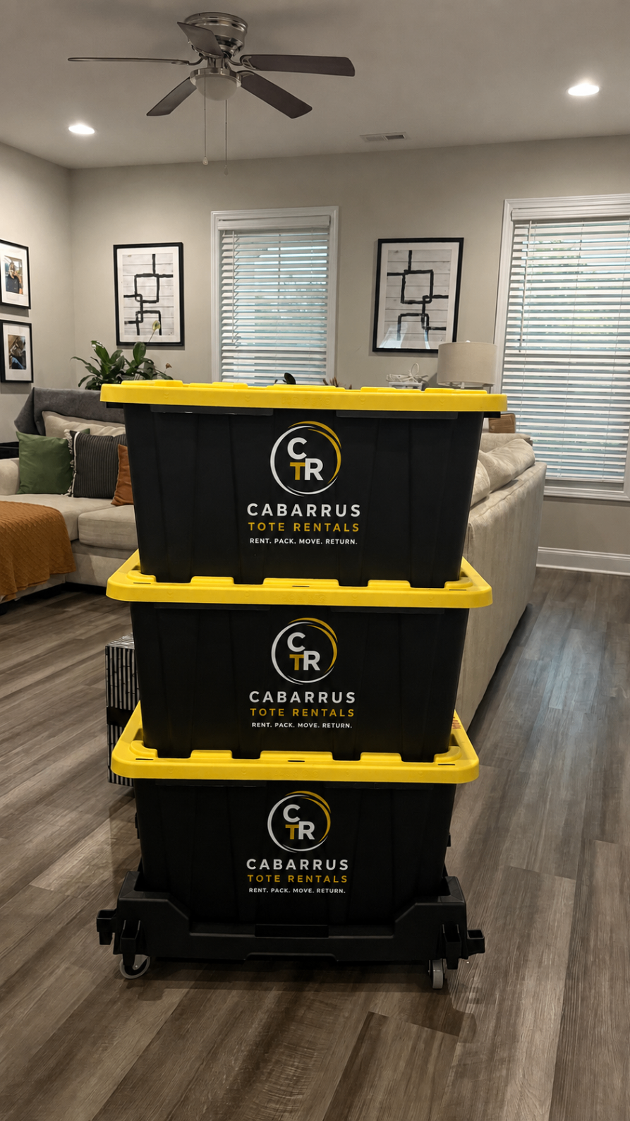 CTR branded moving totes on a Tote Taxi in a Cabarrus County living room