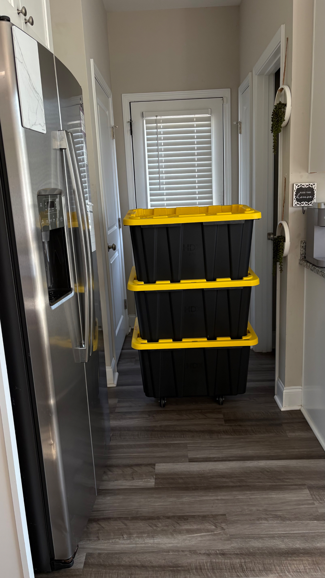 Rented moving totes staged in a kitchen hallway during a Cabarrus County move
